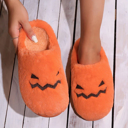 Cozy pumpkin-themed slippers with plush coral velvet upper and non-slip PVC sole for comfortable indoor wear