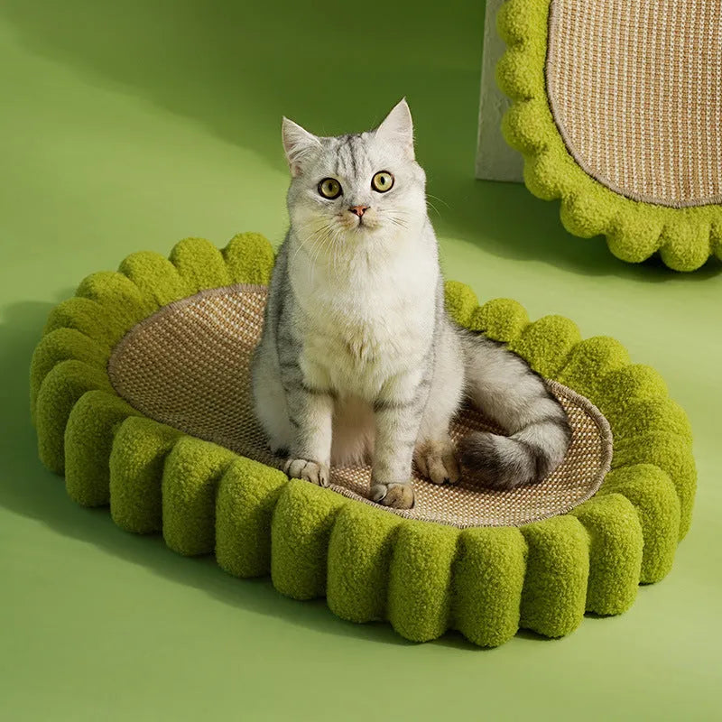 Green oval cat scratcher pad with sisal surface serving as scratching area and cat bed