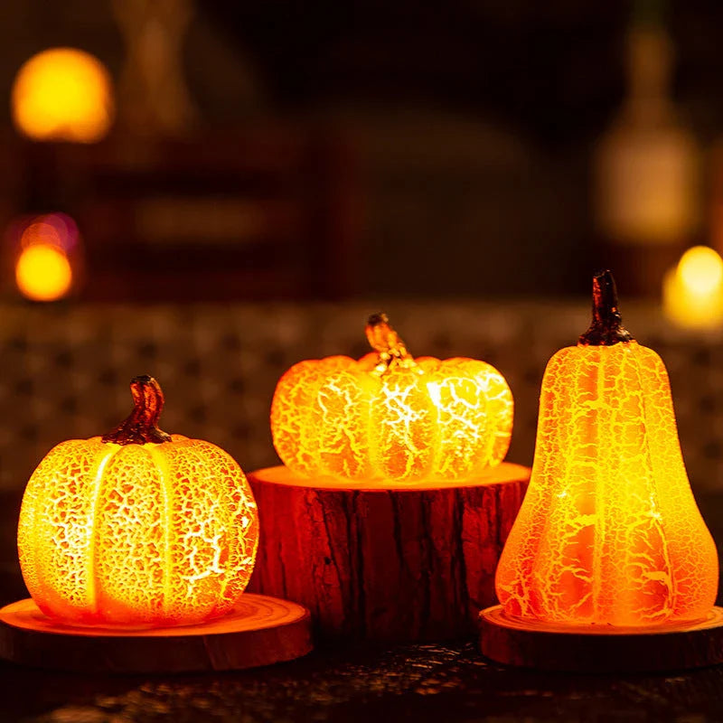 Enchanting resin pumpkin lanterns with realistic textures and LED candle illumination for Halloween decor and celebrations