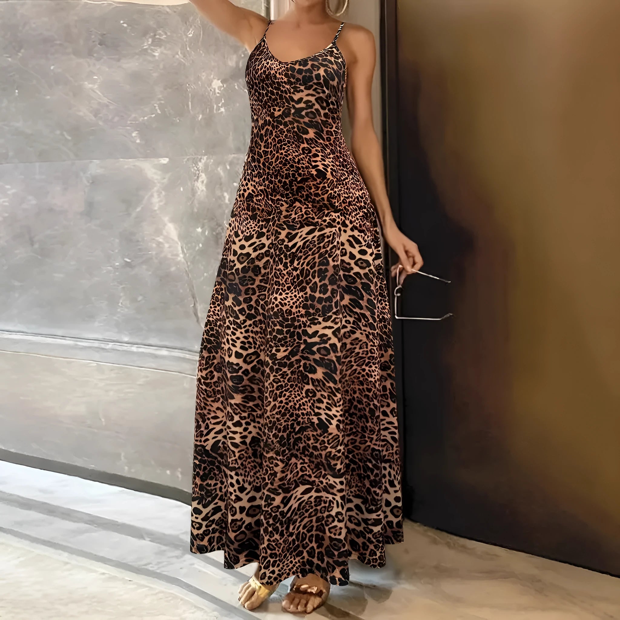 Dark brown leopard print women's dress with round neck, sleeveless design, and long hip skirt.