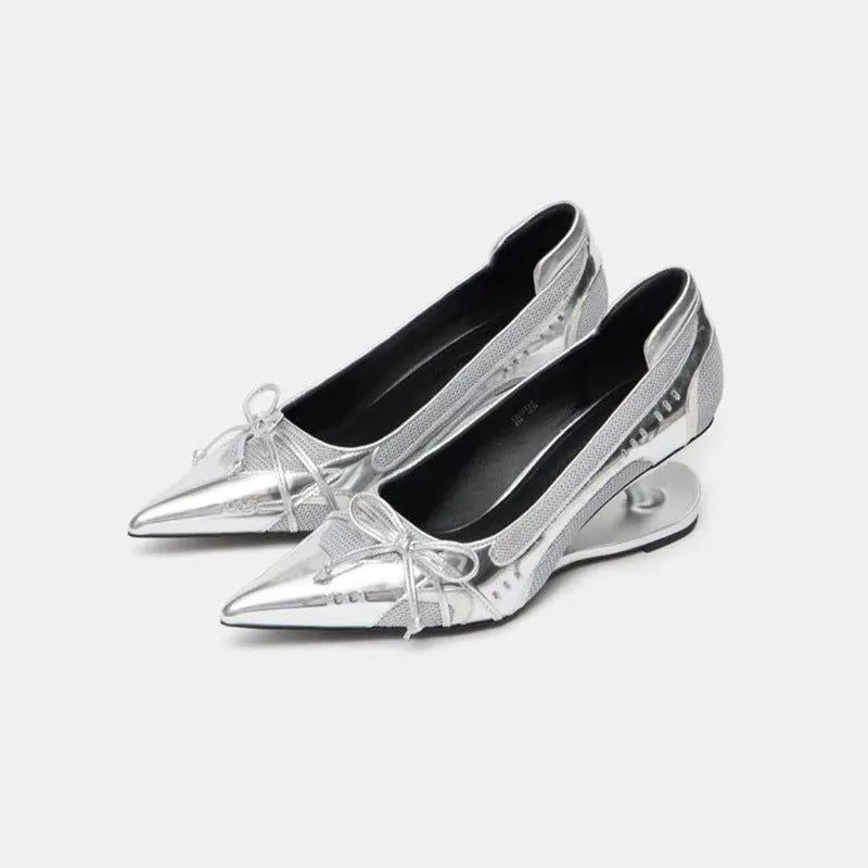 Black women's pointed toe Mary Jane shoes with a floating shaped heel and slip-on design.