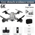 HD aerial photography UAV with folding design in black, showing 30-50cm size and automatic obstacle avoidance sensor