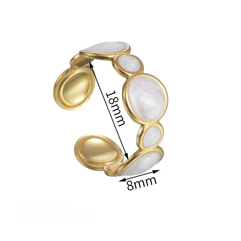 Adjustable stainless steel geometric ring with electroplated finish shown on hand