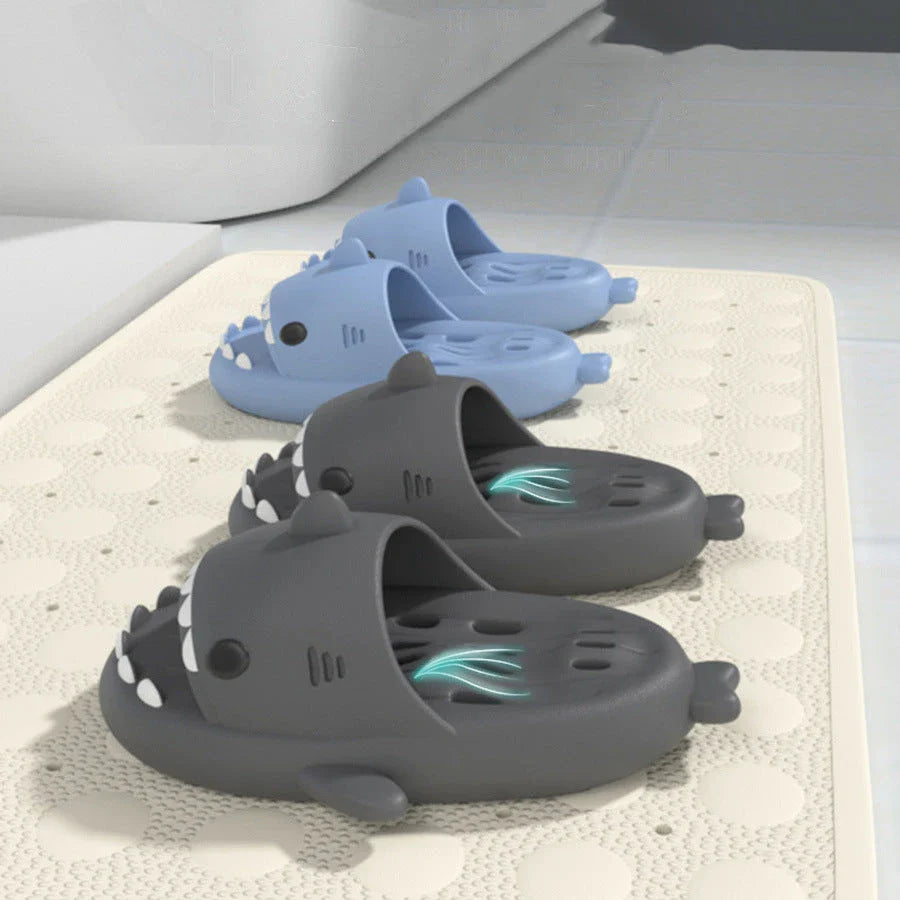 Shark-inspired shower slides with drain holes, featuring authentic shark design details and quick-drying EVA material