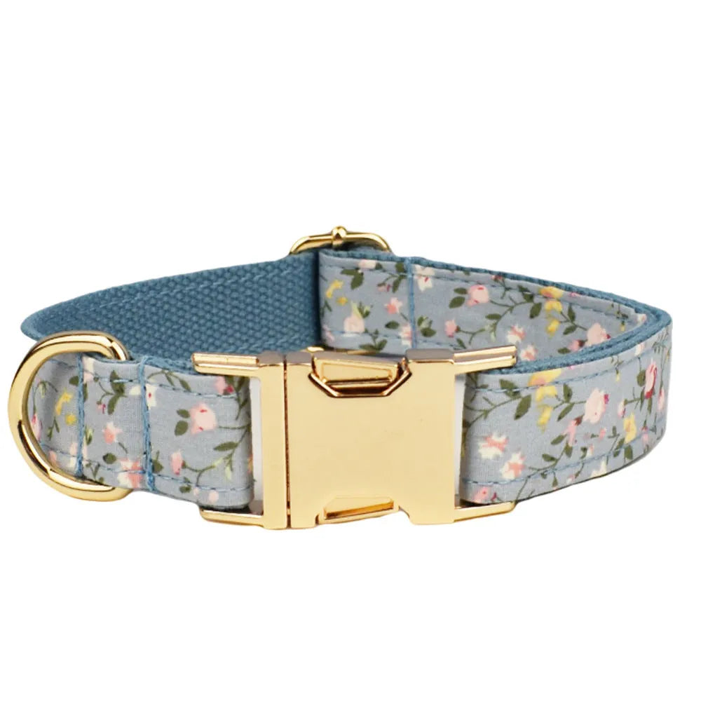 Blue floral polyester cotton dog collar set with matching leash, bow, vest and waste bag holder accessories