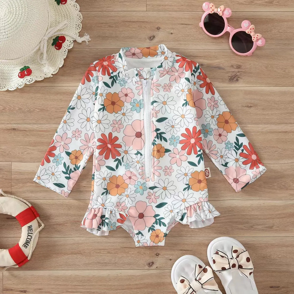 Girls' floral zipper romper swimsuit in pink with front zipper and brief-style bottom