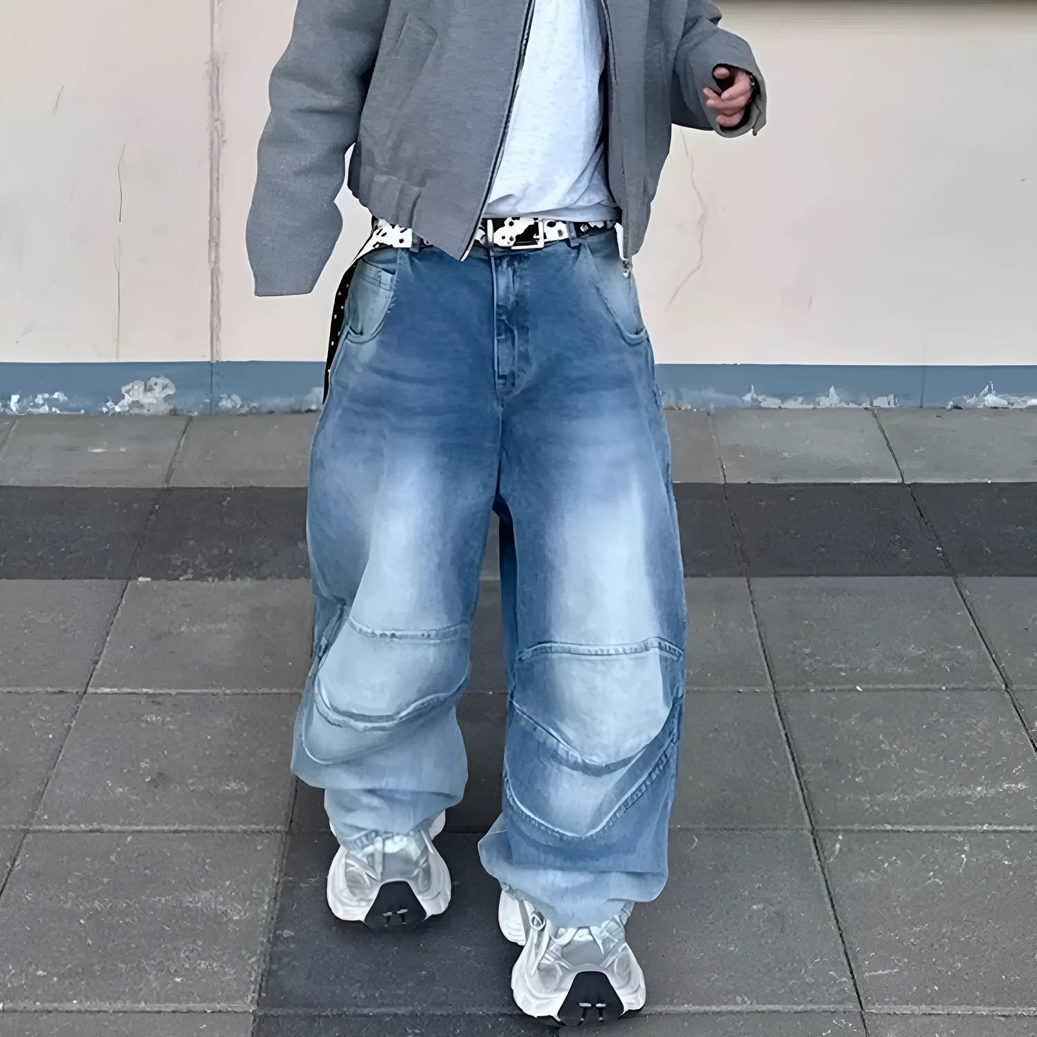 Baggy blue jeans with front pleats and a straight leg, shown in a washed denim finish.