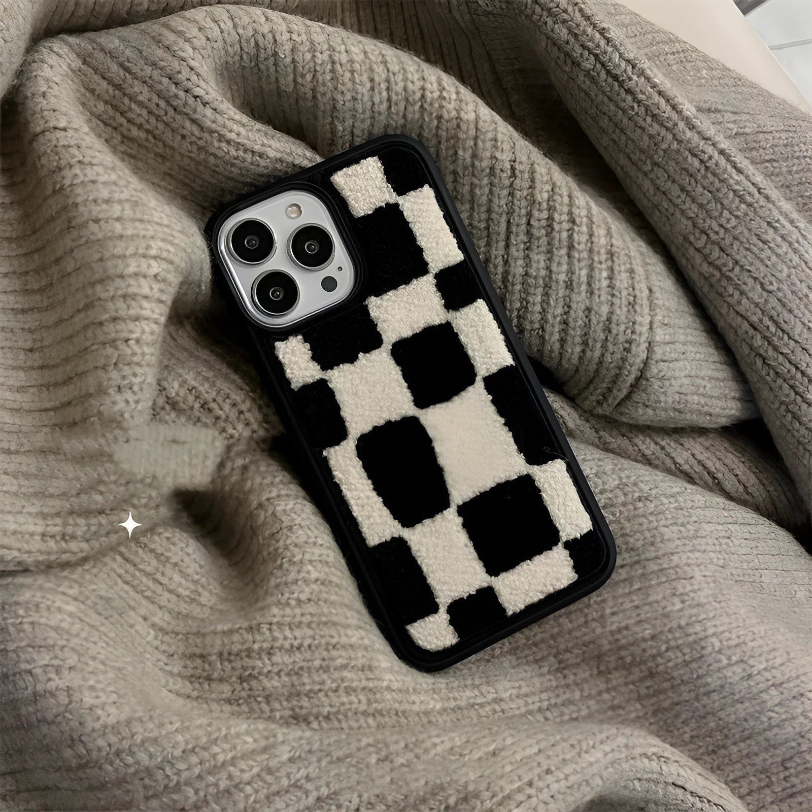 Black and white lattice silicone back cover for Apple iPhone, protective case on a white background