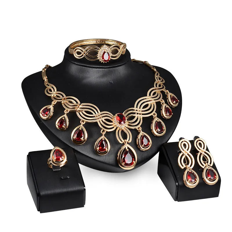 Women's alloy jewellery set with rhinestone pendant, earrings, and bracelet in 18K gold colour