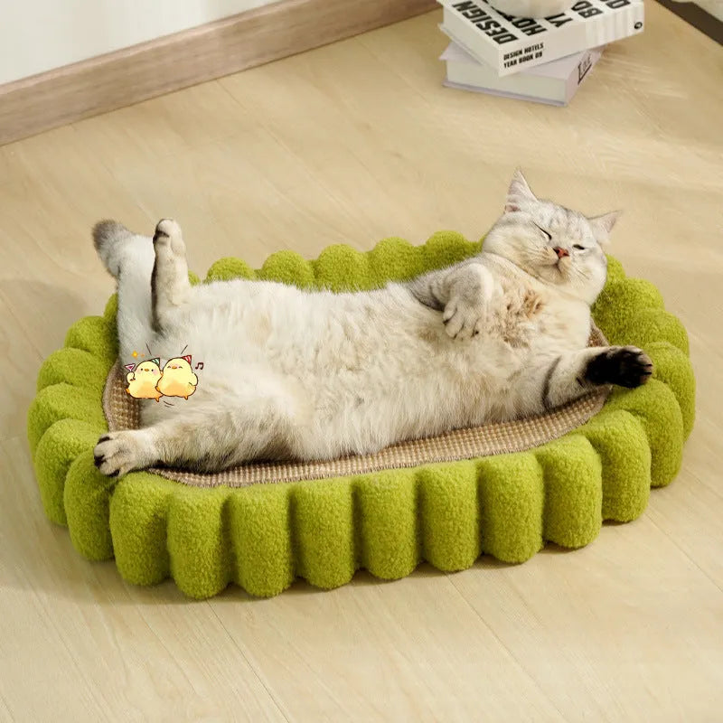 Green oval cat scratcher pad with sisal surface serving as scratching area and cat bed