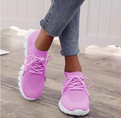 Women's high-cut lace-up platform sneakers in multiple colours on a rubber sole.