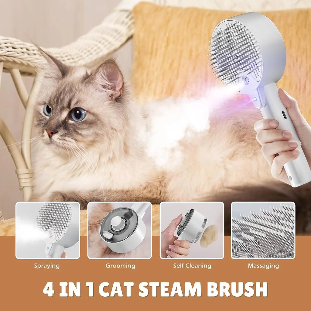 Pink and white cat grooming steam brush with mist function, rounded head, and stainless steel bristles.