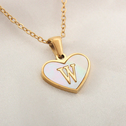 A personalized heart-shaped necklace with a 26-letter charm, crafted from high-quality stainless steel and gold plating.