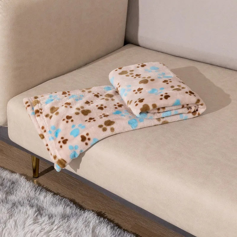 Blue cartoon dog paw pattern pet blanket showing double-sided thickened flannel texture
