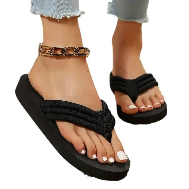 Black women's cotton slippers with ribbon trim and a textured non-slip EVA sole.