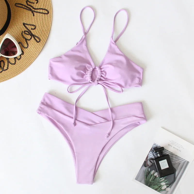 Women's bikini swimsuit with tied bow detail and split front design in solid colour