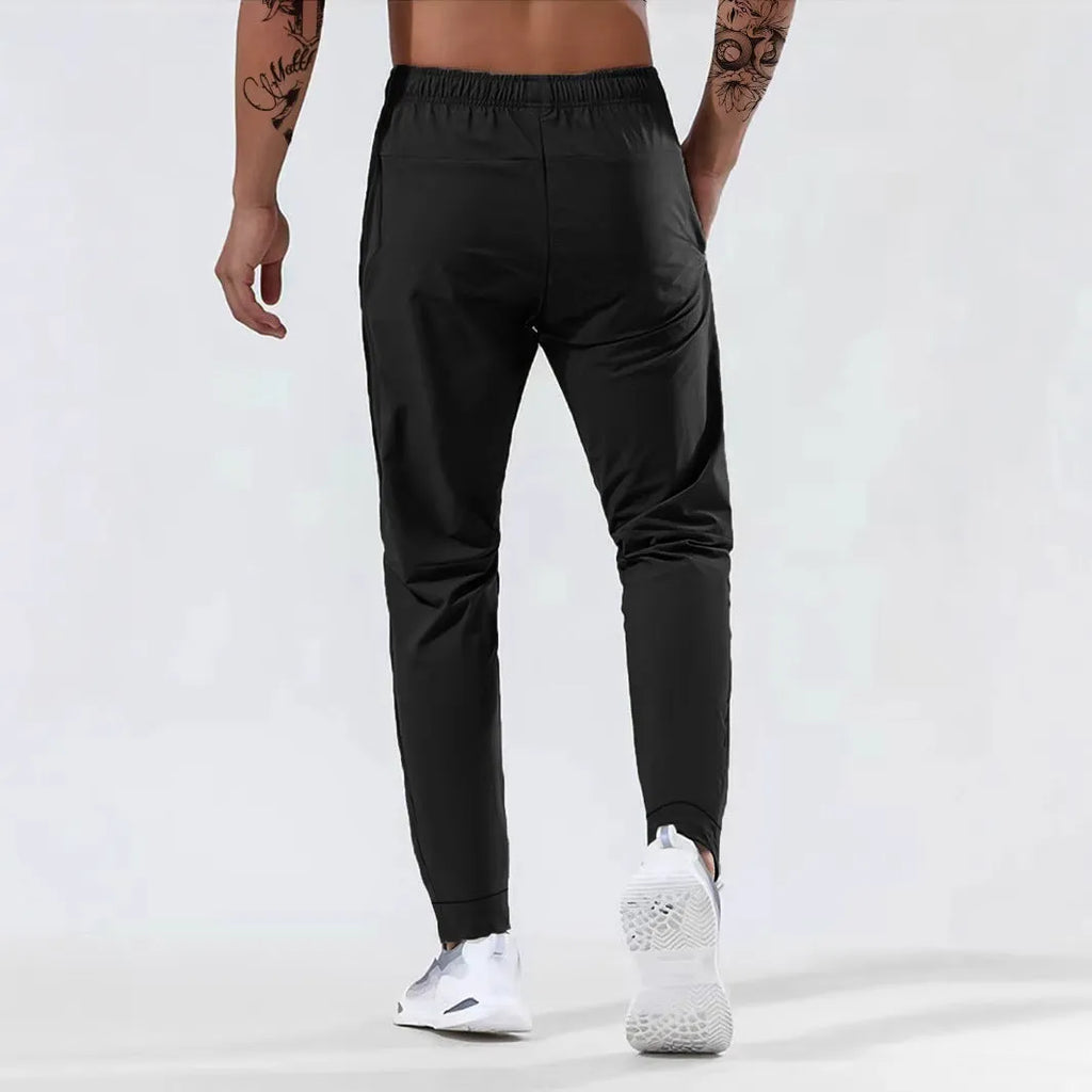 Men's jogging sports pants in nylon blend, mid waist loose fit, available in black gray khaki blue sizes L to 7XL