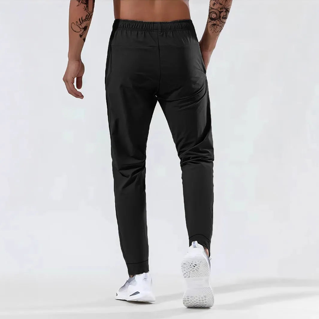 Men's jogging sports pants in nylon blend, mid waist loose fit, available in black gray khaki blue sizes L to 7XL