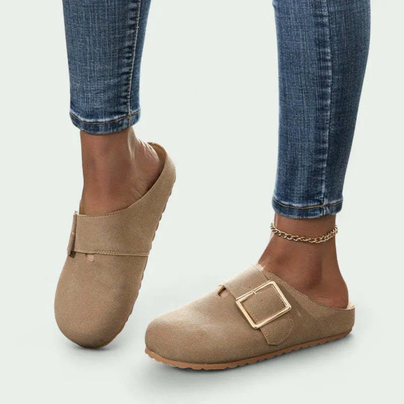 Women's brown closed toe low top canvas slipper shown from the side