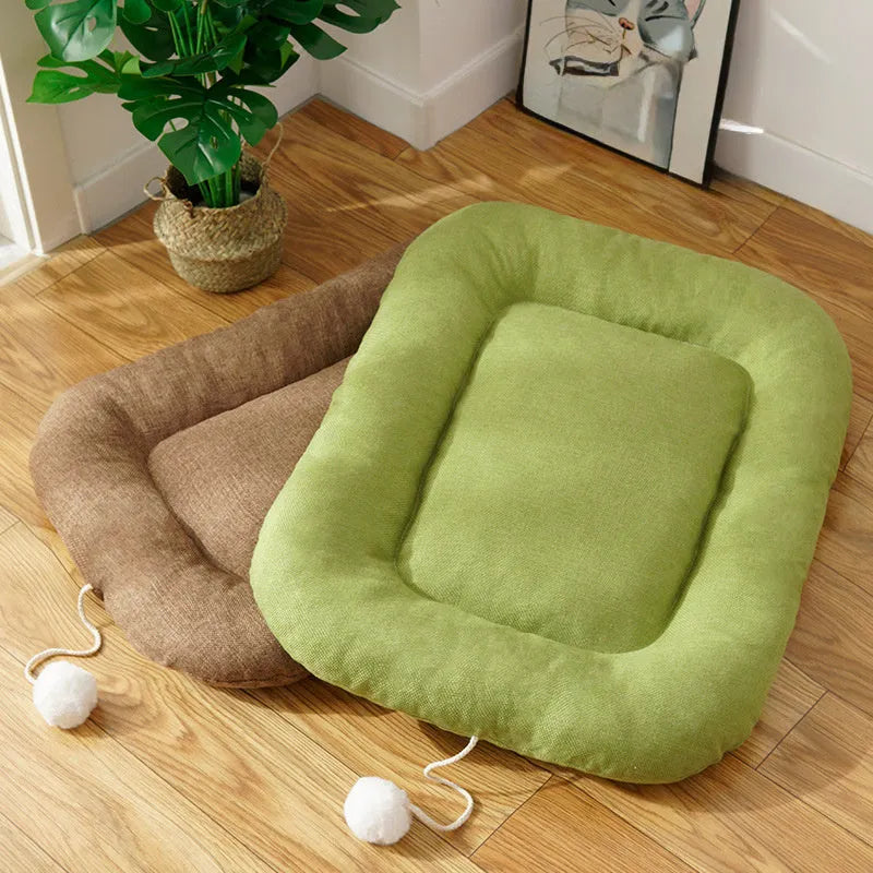 Brown cooling mat for small to medium-sized dogs in kennel setting with size dimensions shown