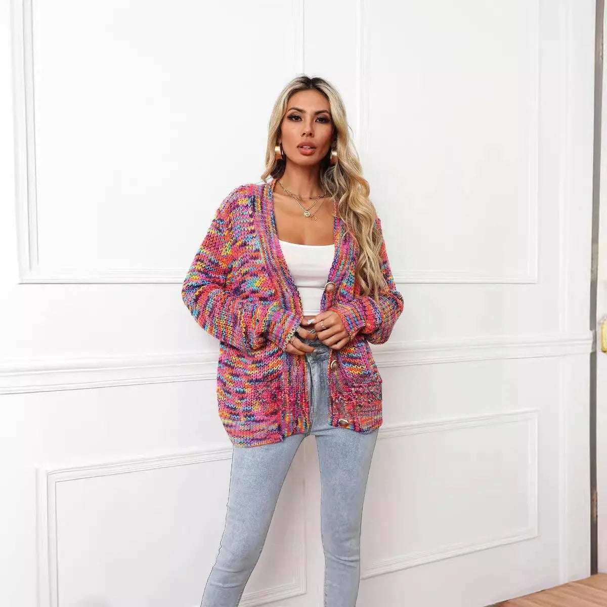 Rose red women's short cardigan with rainbow festival stripes, loose fit, worn open as a coat.