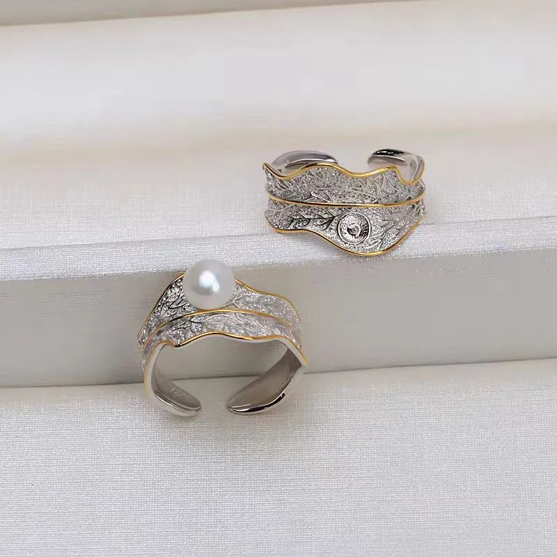 Freshwater pearl ring with irregular leaf design, electroplated metal band, pearl colour, adjustable opening