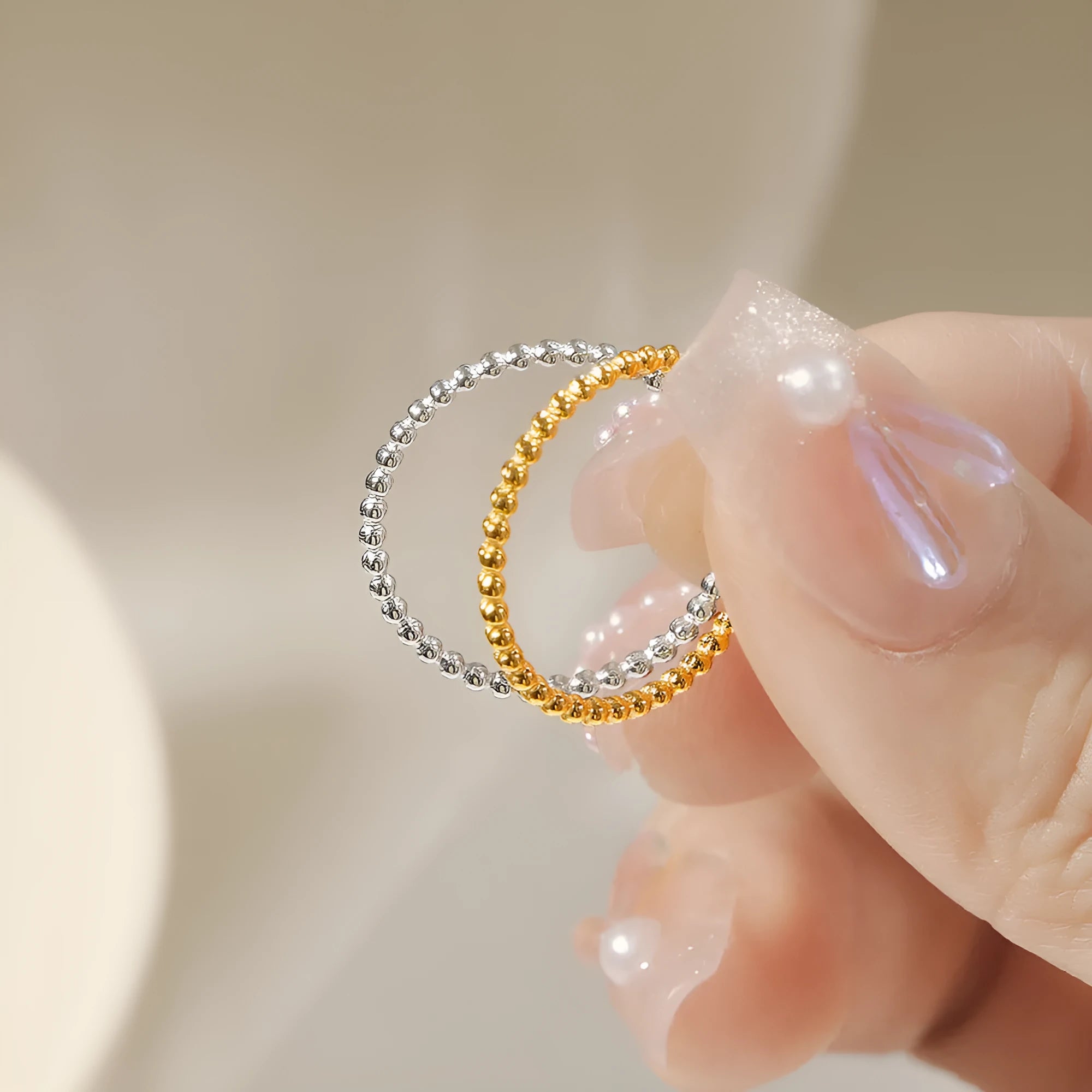 Titanium steel plain circle ring in gold finish on a neutral background