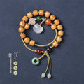 Women's ebony double ring bracelet with hand-woven construction and traditional Ruyi design elements