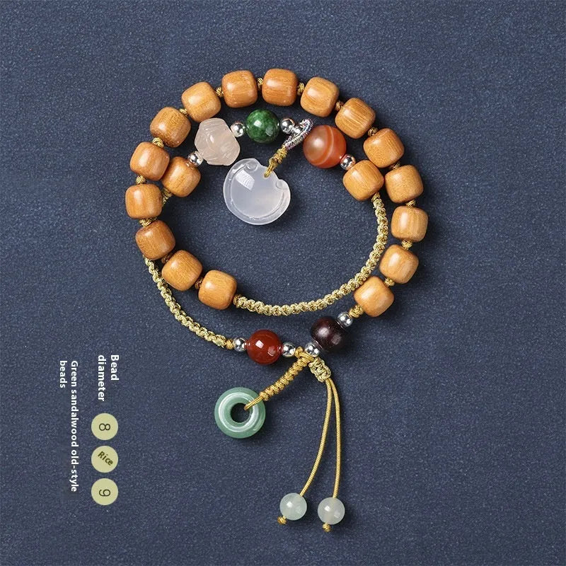 Women's ebony double ring bracelet with hand-woven construction and traditional Ruyi design elements