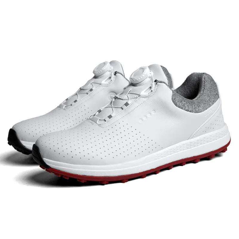 Men's white and black casual low-top golf shoes with breathable upper and traction sole.