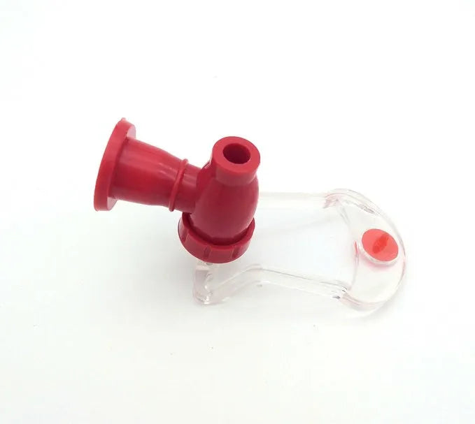 Red plastic Magic Tap soda dispenser attached to inverted 2-litre bottle for push-button drink serving