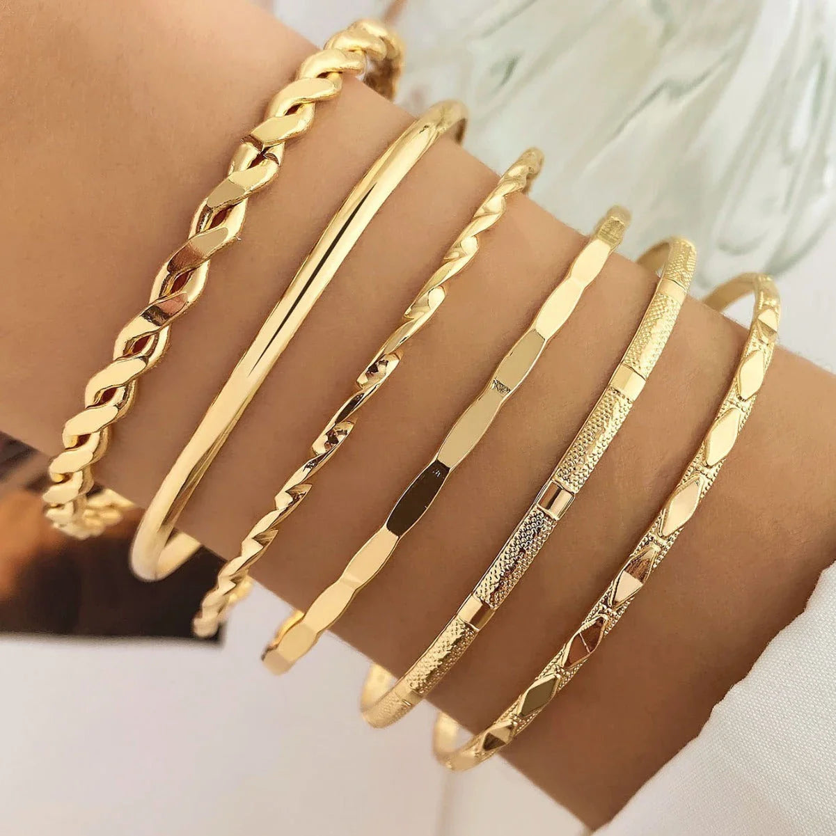 Stylish Bohemian chain bracelets in a gold tone color with geometric shapes, perfect for fashion-forward women