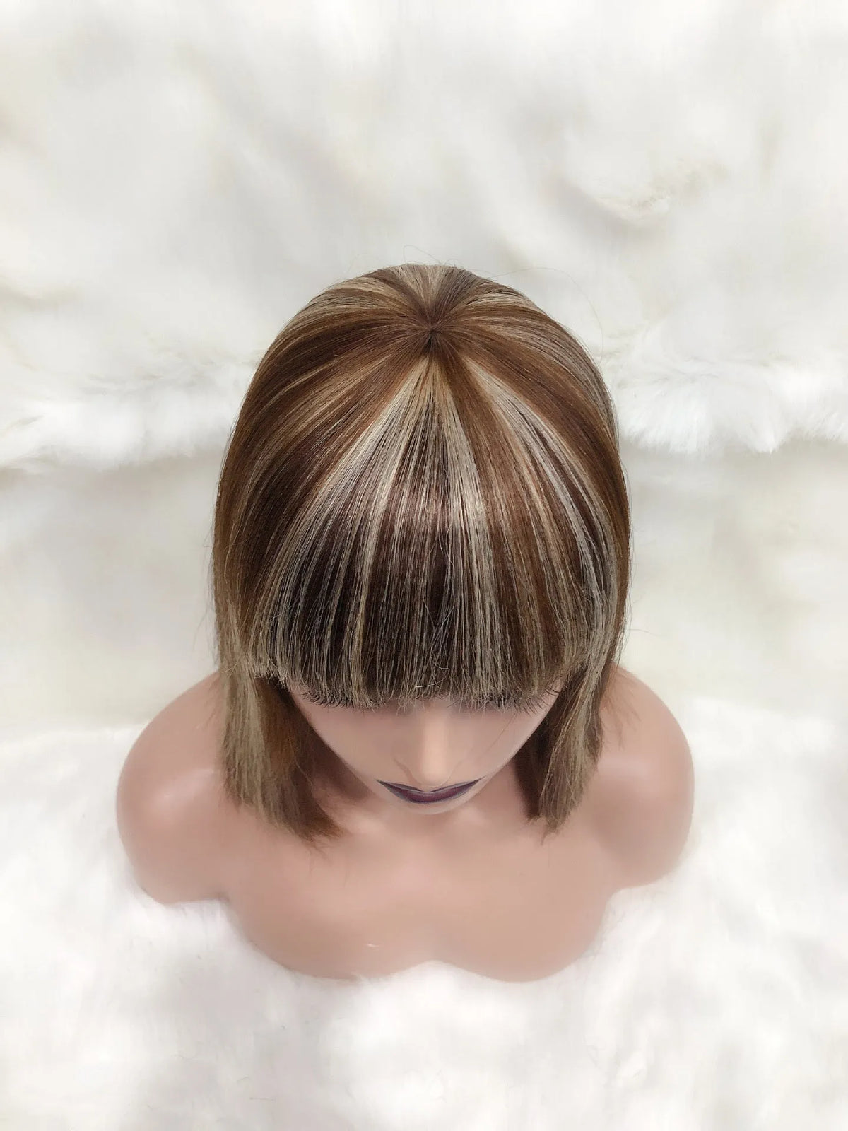 Full Mechanic 4 27 Bob human hair wig in brown with straight bangs, medium length on a mannequin head