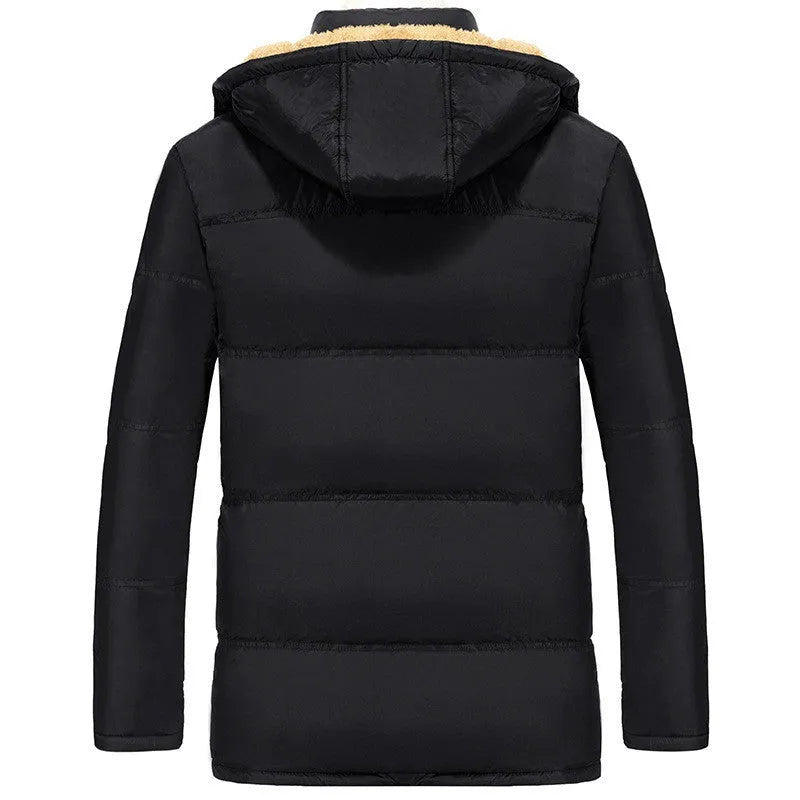 Man wearing a black loose-fit velvet double-breasted hooded winter jacket