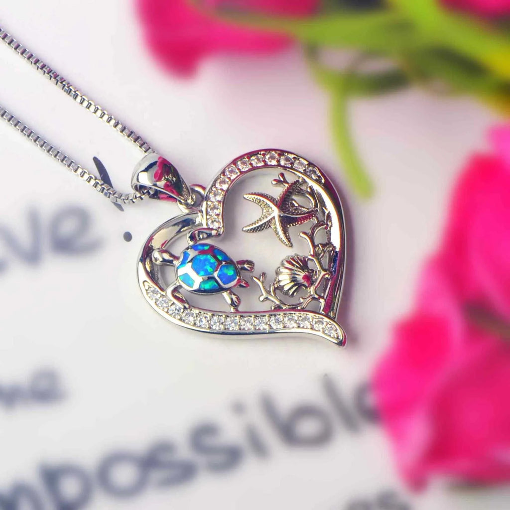 Blue synthetic opal turtle love pendant on copper electroplated base