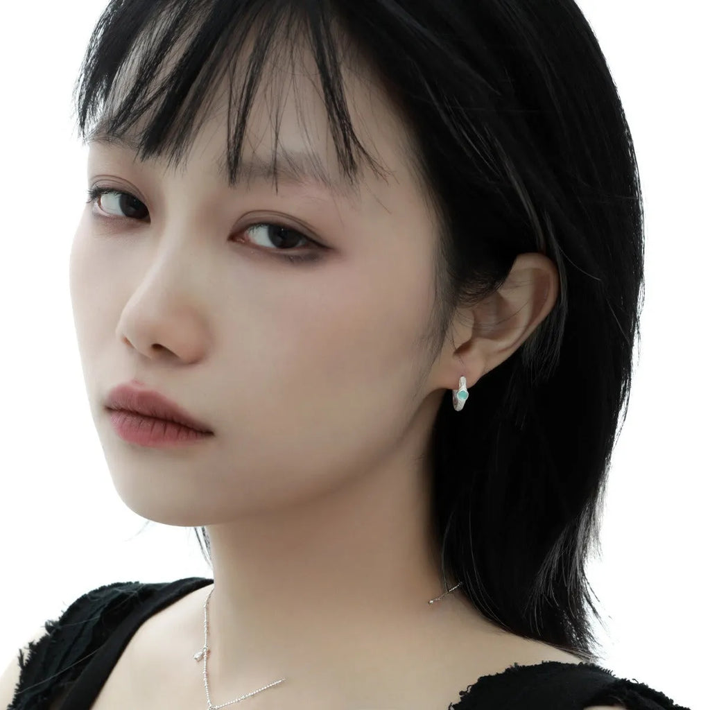 Geometric round ear clip in burnt silver electroplated finish made from 925 sterling silver