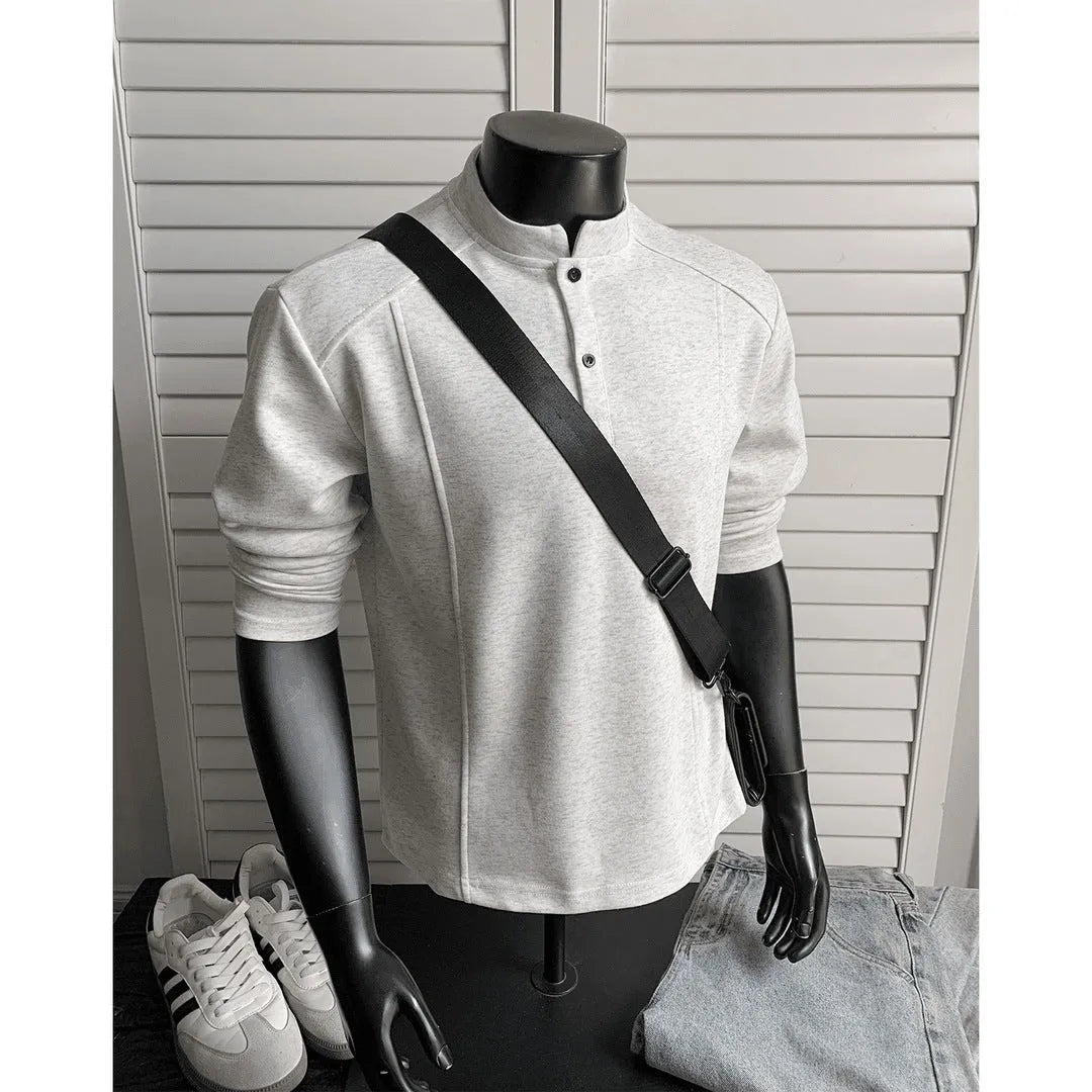 Men's grey polo shirt with patchwork detailing on shoulders and stand-up collar