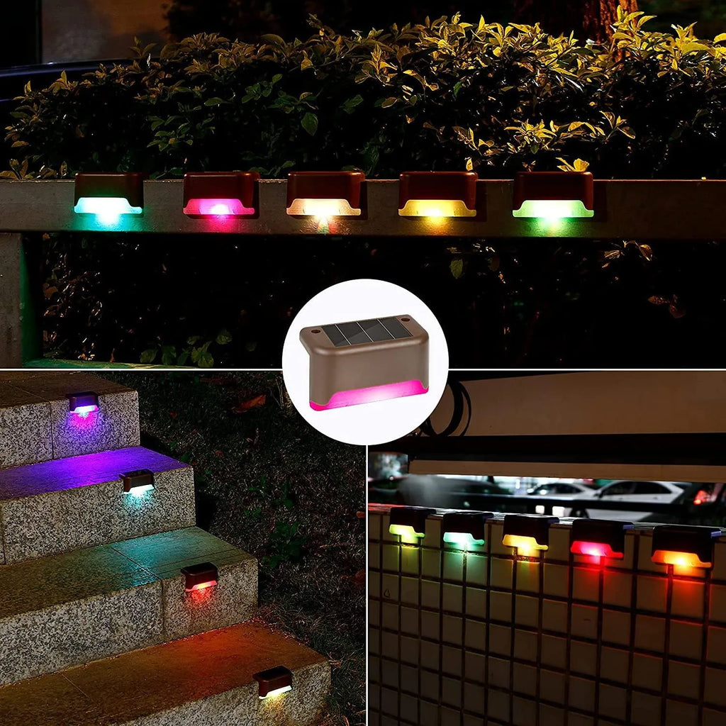 Set of four brown solar step lights with warm LED glow mounted on outdoor wooden stairs