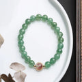 Green strawberry quartz Chinese style bracelet with 7.5mm beads and geometric hand-woven patterns