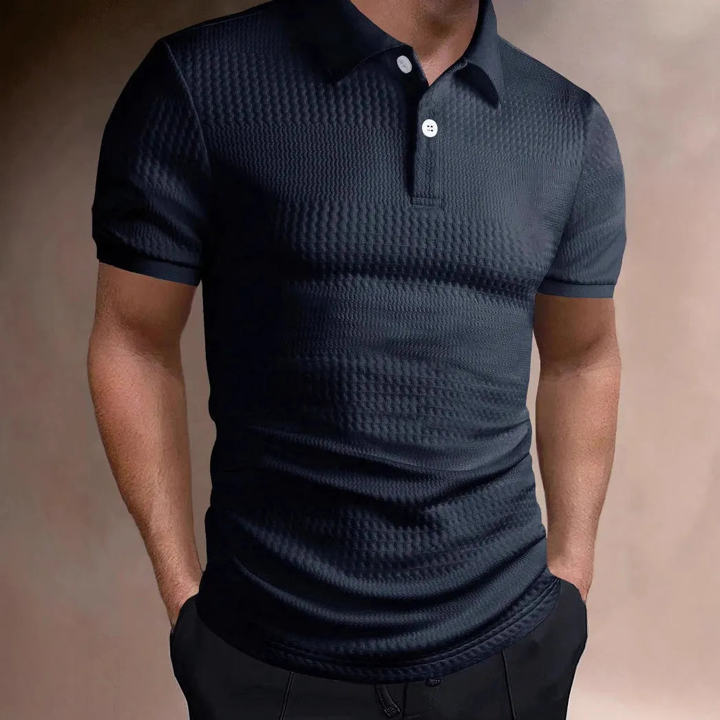 Man wearing a striped loose-fit polo shirt with an asymmetric design in light blue.