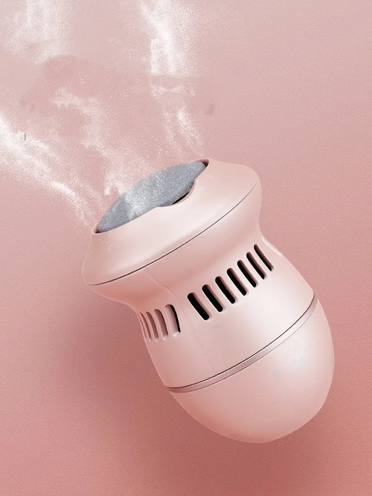 Beige and white USB-charged electric foot file grinder with vacuum system and two diamond grinding heads.