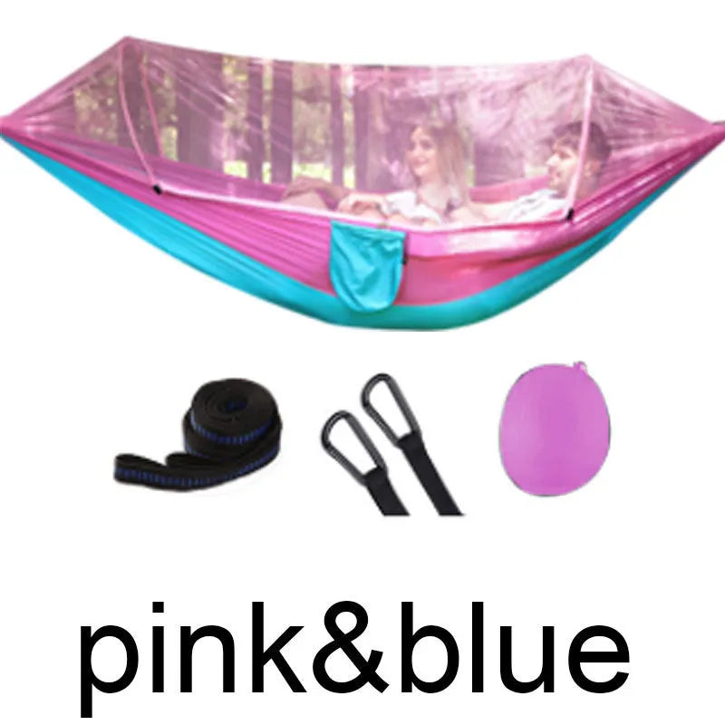 Double hammock bed 260x150cm in Army Green with mosquito-blocking mesh on a camping site