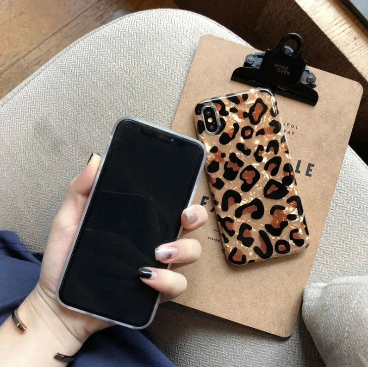 Colourful leopard print pattern on a black silicon and TPU iPhone case for XR or XS MAX.