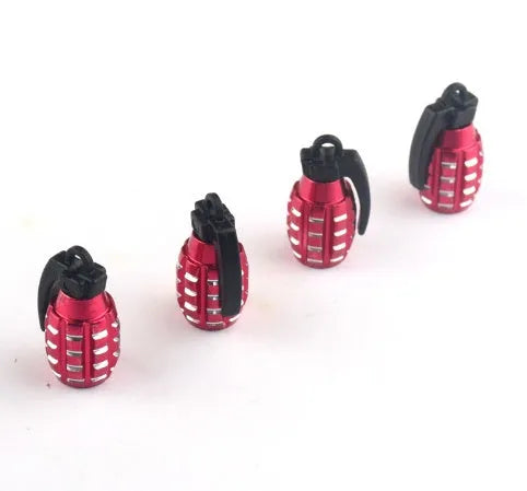 Two car tyre valve caps in red, blue, and gold colours on a white background