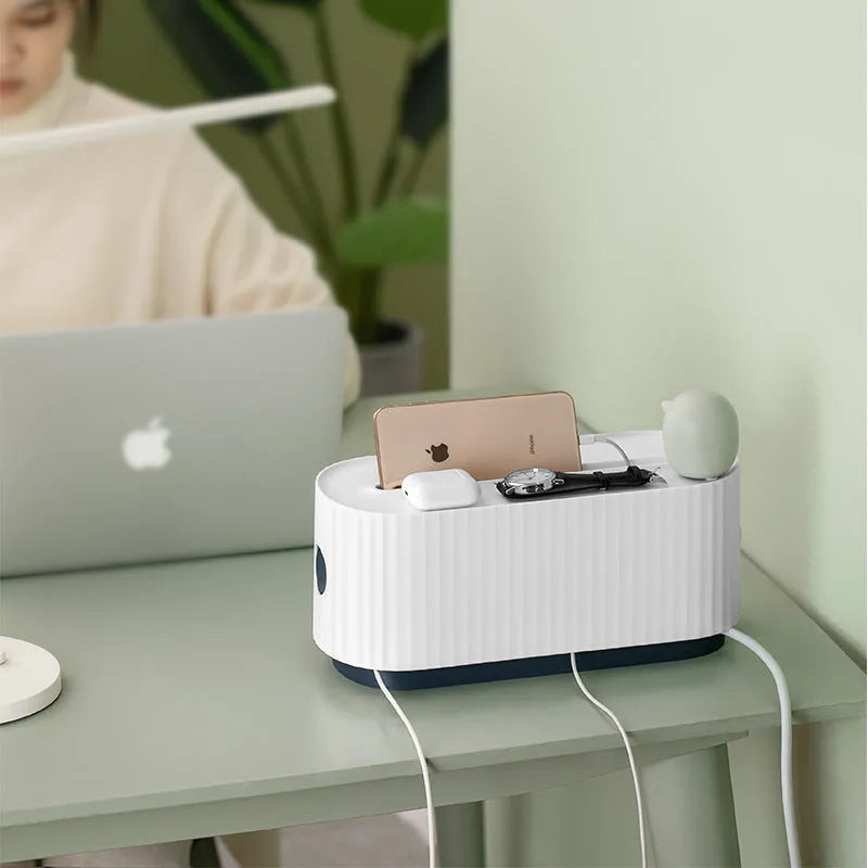 Blue and white HIPS plastic power strip storage box with lid open, showing phone slot and cable holes.