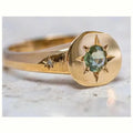 Golden adjustable ring with oval star shape and zircon micro inlay detail.