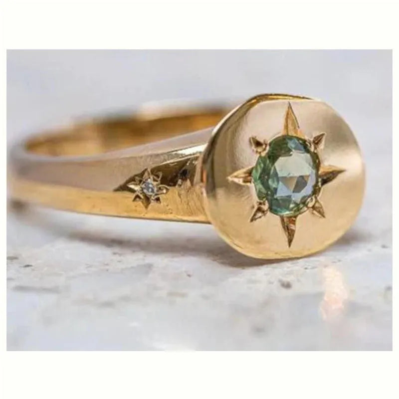 Golden adjustable ring with oval star shape and zircon micro inlay detail.