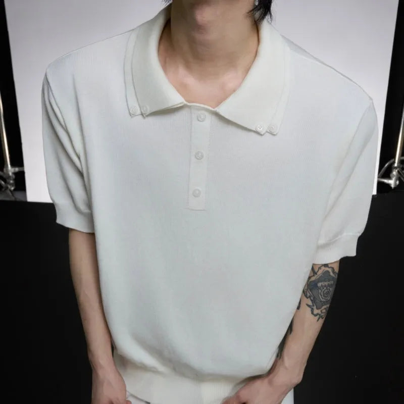 Man wearing a grey slim knit short sleeve shirt with a double lapel collar design.