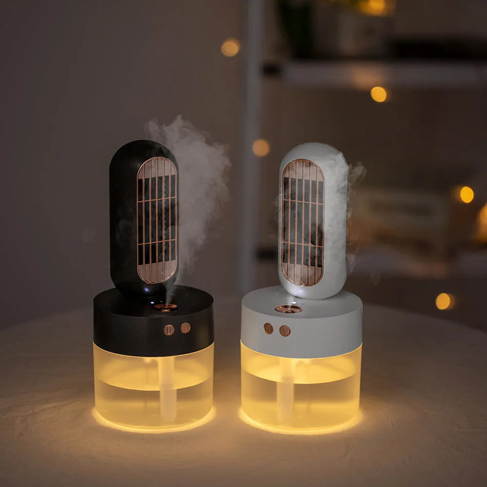 Small black and white humidifier fan with an oscillating head on a desk.