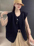Women's loose fit sleeveless vest in solid colour with side pockets.